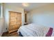 Serene bedroom featuring hardwood floors, a spacious closet, and natural light at 4257 Graham Ct, Boulder, CO 80305