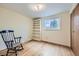 Bright bedroom features a window, hardwood floors, and a built-in bookshelf at 4257 Graham Ct, Boulder, CO 80305