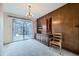 Dining area featuring wood paneling, a glass door to the outside, and a light fixture at 4257 Graham Ct, Boulder, CO 80305