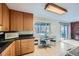 Bright kitchen featuring wood cabinets, modern appliances, and a view to the backyard through the window at 4257 Graham Ct, Boulder, CO 80305