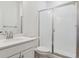 Clean, bright bathroom with a glass-enclosed shower at 8229 Butte Creek St, Littleton, CO 80125