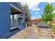 Backyard with a built-in grill, patio, stone accents, and lush greenery at 2474 Ravenswood Ct, Longmont, CO 80504