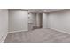 A finished basement featuring neutral paint, carpeted floor, and a stylish bar area at 2474 Ravenswood Ct, Longmont, CO 80504