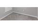 Neutral basement featuring clean gray carpet, white baseboards and walls, plus electrical outlets at 2474 Ravenswood Ct, Longmont, CO 80504