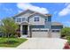Charming two-story home featuring a three-car garage, landscaped yard, and a welcoming entrance at 2474 Ravenswood Ct, Longmont, CO 80504