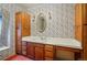 Charming bathroom with a vanity and floral wallpaper that evokes a sense of nostalgia and comfort at 618 S Franklin St, Denver, CO 80209