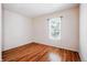 Bedroom featuring hardwood floors and a window offering plenty of natural light at 618 S Franklin St, Denver, CO 80209