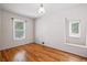 Cozy bedroom with hardwood floors and two windows that provide ample natural light at 618 S Franklin St, Denver, CO 80209