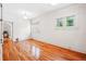 Bright bedroom showcasing hardwood floors, neutral walls, and double windows at 618 S Franklin St, Denver, CO 80209
