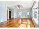 Bright bedroom featuring hardwood floors and multiple windows at 618 S Franklin St, Denver, CO 80209