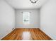 Bedroom featuring hardwood floors and a window offering plenty of natural light at 618 S Franklin St, Denver, CO 80209