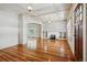Open living space featuring hardwood floors, coffered ceiling, fireplace, and natural light at 618 S Franklin St, Denver, CO 80209