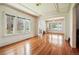 Expansive living room featuring hardwood floors, coffered ceilings, and lots of light at 618 S Franklin St, Denver, CO 80209