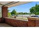 Scenic porch view overlooking a serene lake and tree-lined street at 618 S Franklin St, Denver, CO 80209