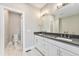 Bright bathroom with double vanity, white cabinetry, and stylish fixtures at 2323 Lakeshore Ln # 11, Superior, CO 80027