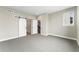 Bedroom features modern sliding barn doors, an open layout, and gray carpet at 2323 Lakeshore Ln # 11, Superior, CO 80027
