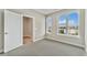 Bright bedroom with serene lake views from large windows, offering a peaceful retreat at 2323 Lakeshore Ln # 11, Superior, CO 80027