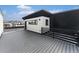 Home exterior featuring large deck with modern railings and a sleek siding design at 2323 Lakeshore Ln # 11, Superior, CO 80027