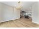 Bright dining room featuring hardwood floors, stylish lighting, and an open layout to the kitchen at 2323 Lakeshore Ln # 11, Superior, CO 80027