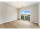 Well-lit dining room with natural light, a modern chandelier, and wood floors, perfect for hosting meals at 2323 Lakeshore Ln # 11, Superior, CO 80027