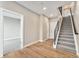 Inviting entryway featuring wood floors, staircase, and access to a room, creating a warm and welcoming atmosphere at 2323 Lakeshore Ln # 11, Superior, CO 80027