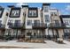 Attractive modern townhome exterior featuring private balconies and a stone and stucco facade at 2323 Lakeshore Ln # 11, Superior, CO 80027