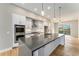 Stylish kitchen with stainless appliances, a spacious island, and pendant lighting, ideal for cooking and gathering at 2323 Lakeshore Ln # 11, Superior, CO 80027