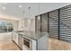 Kitchen island featuring stainless steel appliances, stone countertops, and pendant lighting at 2323 Lakeshore Ln # 11, Superior, CO 80027