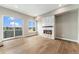 Living area boasting lake views from large windows and a modern fireplace, creating a cozy atmosphere at 2323 Lakeshore Ln # 11, Superior, CO 80027