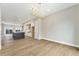 Open living space, featuring the kitchen and dining area with recessed lights and wood floors at 2323 Lakeshore Ln # 11, Superior, CO 80027