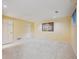 Finished basement with neutral carpeting, ample lighting, and painted walls at 345 Harrison St, Denver, CO 80206