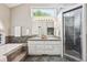 Primary bathroom featuring soaking tub, shower, and dual sink vanity at 345 Harrison St, Denver, CO 80206