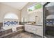 Bright bathroom with soaking tub, shower and dual sinks at 345 Harrison St, Denver, CO 80206