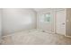 Neutral bedroom features a large window for natural light and a convenient door at 345 Harrison St, Denver, CO 80206