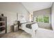 Comfortable bedroom with large windows, closet, and neutral decor at 345 Harrison St, Denver, CO 80206