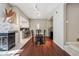 Dining area with modern lighting, adjacent to the kitchen, and views of the fireplace at 345 Harrison St, Denver, CO 80206