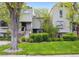 Charming townhomes with a well-manicured lawn and mature landscaping, creating an inviting curb appeal at 345 Harrison St, Denver, CO 80206