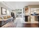 Cozy living room features a fireplace, skylights, and sliding glass doors to the outdoor patio at 345 Harrison St, Denver, CO 80206
