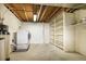 A modern basement laundry area featuring newer appliances with ample lighting and storage potential at 11771 Pennsylvania St, Northglenn, CO 80233