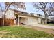 Exterior shot of a two-story home featuring a two-car garage and well-maintained landscaping at 11771 Pennsylvania St, Northglenn, CO 80233