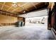 Open garage featuring a large space, pegboard for storage, and view of the neighborhood street at 11771 Pennsylvania St, Northglenn, CO 80233