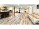 Expansive basement with a finished bar area, neutral walls, and wood-look flooring throughout at 295 Kitselman Dr, Castle Rock, CO 80104