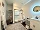 Well-lit bathroom featuring a glass shower, decorative rug, and modern vanity at 295 Kitselman Dr, Castle Rock, CO 80104