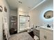 Stylish bathroom with a glass-enclosed shower, a modern vanity with a sleek countertop, and contemporary fixtures at 295 Kitselman Dr, Castle Rock, CO 80104