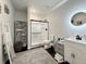 Modern bathroom features a vanity, decorative mirror, and a sliding glass shower door at 295 Kitselman Dr, Castle Rock, CO 80104