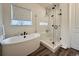 Bathroom with a freestanding tub and glass shower at 295 Kitselman Dr, Castle Rock, CO 80104