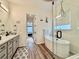 Modern bathroom with soaking tub, glass shower, and gray vanity with white marble countertop at 295 Kitselman Dr, Castle Rock, CO 80104