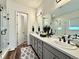 Elegant bathroom with double sinks, and vanity with granite countertops at 295 Kitselman Dr, Castle Rock, CO 80104