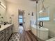 Bathroom featuring tile flooring, a freestanding tub, glass enclosed shower, and modern vanity at 295 Kitselman Dr, Castle Rock, CO 80104