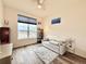 Cozy bedroom features natural light and views from a large window, plus modern furnishings at 295 Kitselman Dr, Castle Rock, CO 80104
